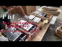 नीचे के खोल पर गर्मी एक्सचेंजर और बर्नर रखें